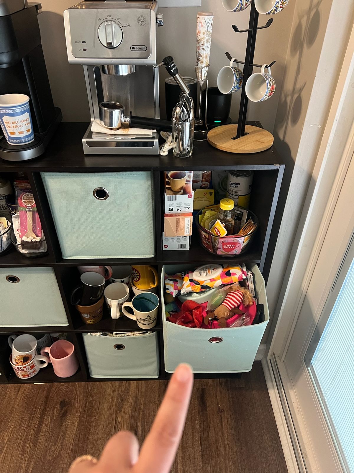 The blue toy cubby under the coffee machine